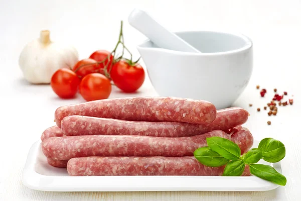 Fresh raw minced meat sausages