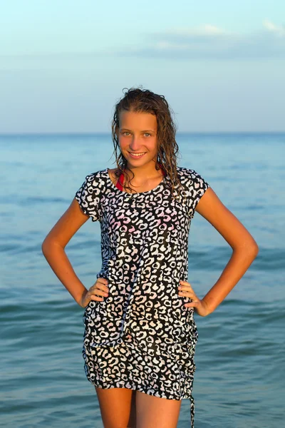 Smiling teen girl in wet dress