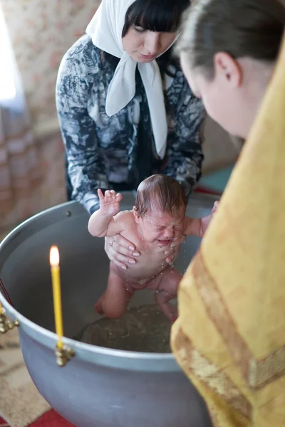 Priest of Sretenskaya church performs baptism ceremony