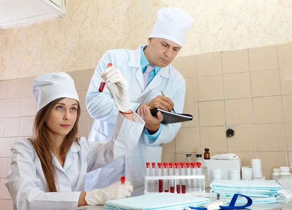 Nurse and male doctor works in clinic lab