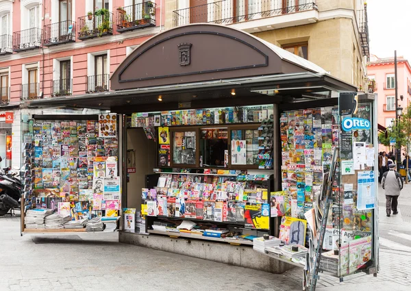 Outdoor stands with newspapers and magazines at street
