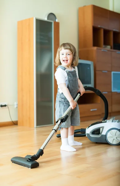 2 years girl with vacuum cleaner