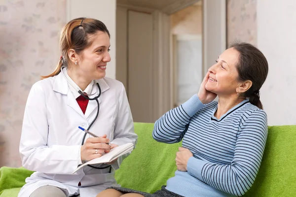 Doctor asked happy female mature patient feels