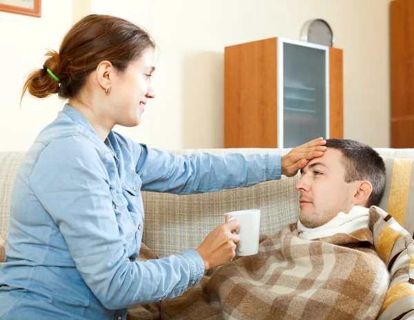 Woman caring for sick man