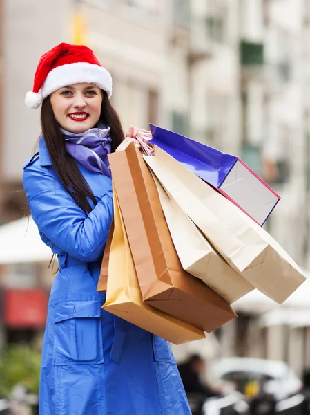 Woman with shopping bags during the Christmas sales
