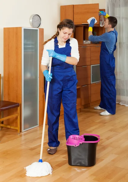 Cleaners cleaning in room