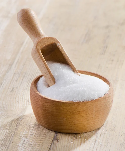 Sugar on wooden table