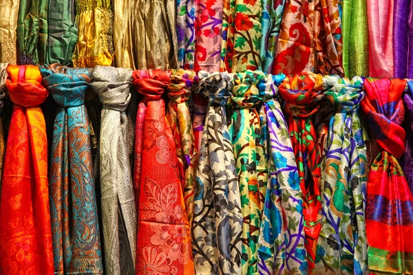 Colourful silk scarfs hanging at a market stall in Istanbul