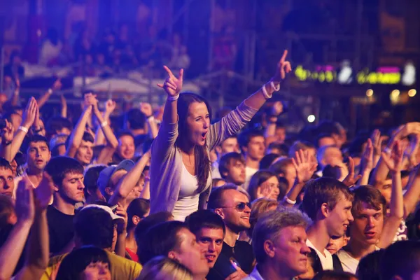 People dance during rock concert