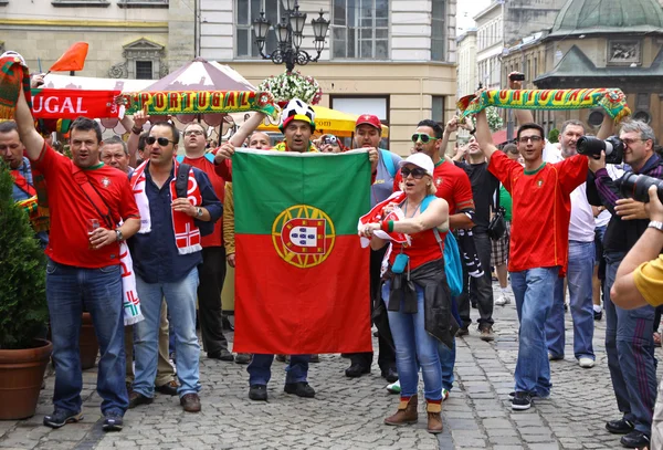 Portugal football team supporters walk on a streets of Lviv