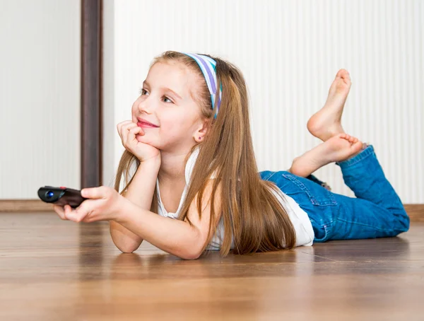Girl holding a remote control