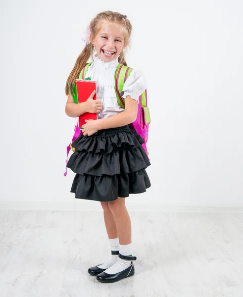 Cute little girl in school uniform