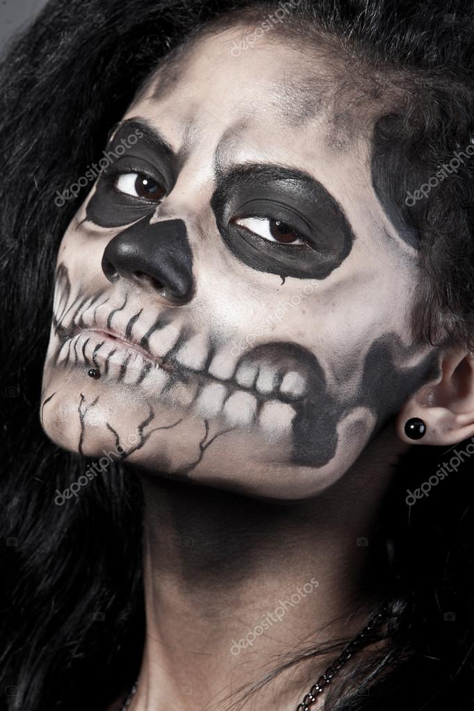 depositphotos_13843246-Young-woman-in-day-of-the-dead-mask-skull.-Halloween-face-art.jpg