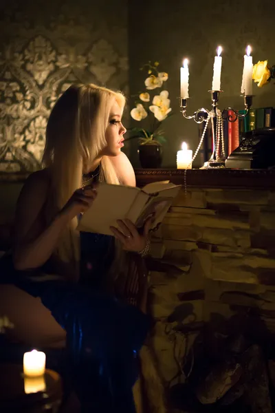 Young girl  sitting with old book