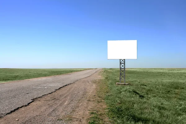 Blank billboard in desert