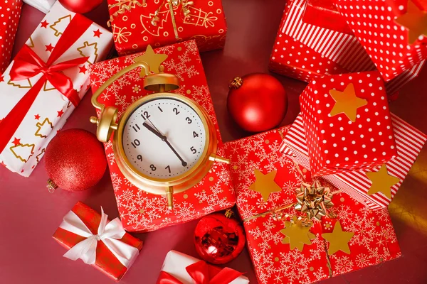 Christmas gifts in red boxes on a red background — Stock Photo #36628971