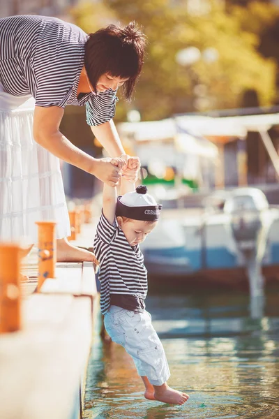 Woman with son on pier