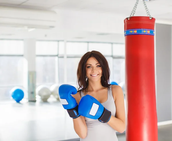 Boxer - fitness woman boxing wearing boxing gloves.