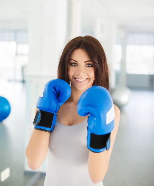 Boxer - fitness woman boxing wearing boxing gloves.