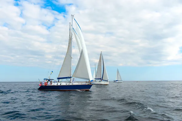 Small sailing boat in blue and calm sea
