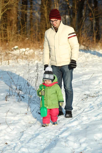 Dad walks with a young child