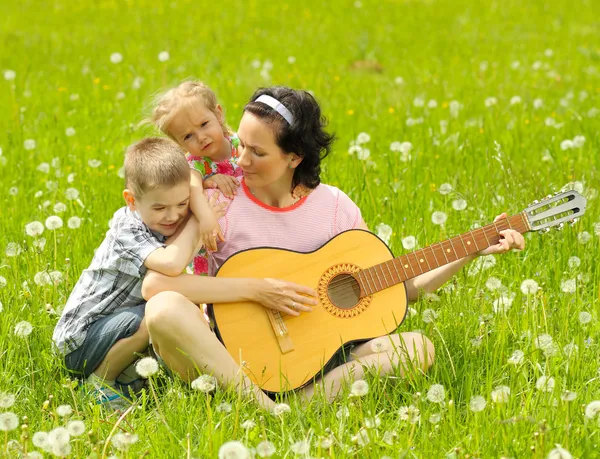 Family playing guitar