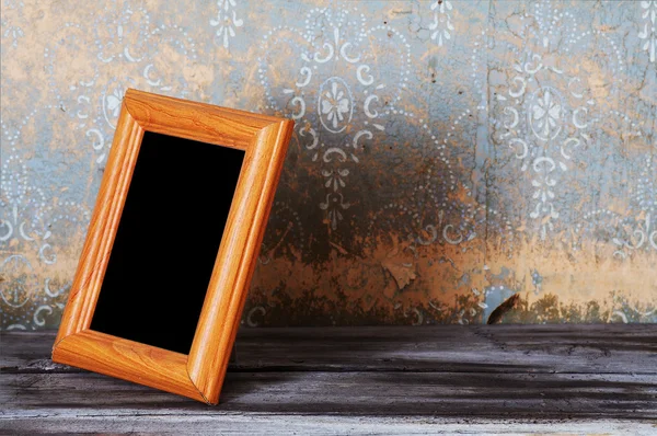 Vintage photo-frame on table