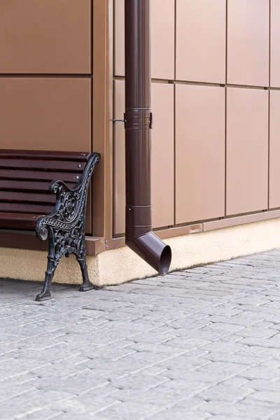 Downspout and bench