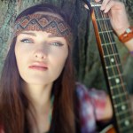 http://st.depositphotos.com/1000745/1347/i/110/depositphotos_13475887-Hippie-girl-with-guitar.jpg