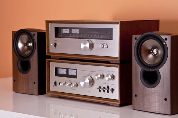 Vintage hi-fi Stereo Amplifier tuner and speakers in wooden cabi