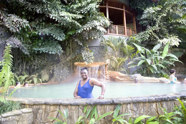 Swimming pool with a waterfall and hot thermal water