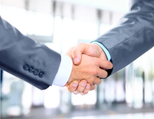 Closeup of a business hand shake between two colleagues