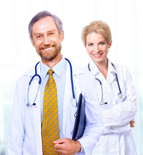 A medical team of doctors, man and woman, isolated on white background