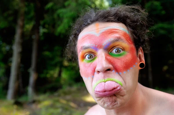 Indian Wearing Face Paint Showing His Tongue