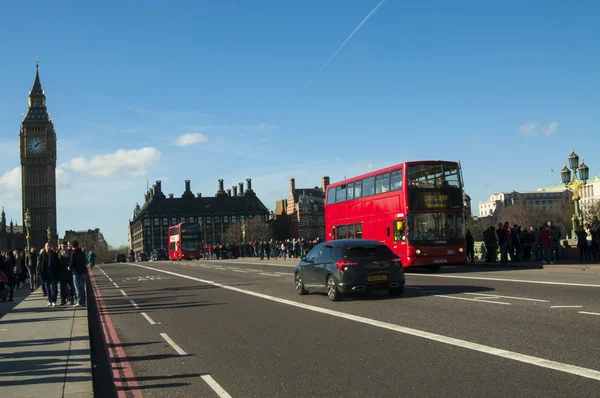 London traffic with red bus and Big Ben