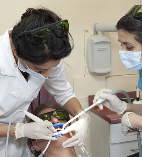 Visit to the dentist. Dentist at work in dental room