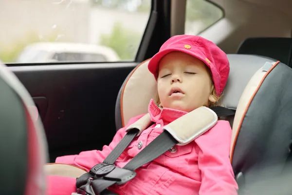 Girl sleeping in car seat