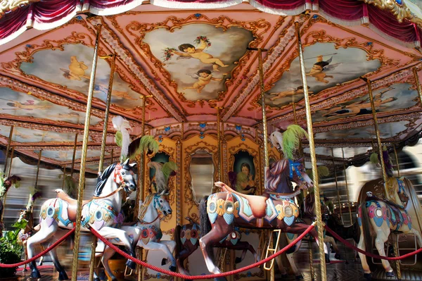 Horse rides on a merry-go-round carousel on Piazza della Repubblica in Florence, Italy