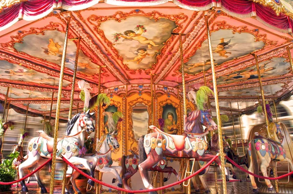 Horse rides on a merry-go-round carousel on Piazza della Repubblica in Florence, Italy