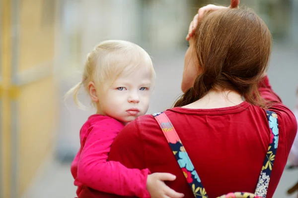 Mother holding   girl