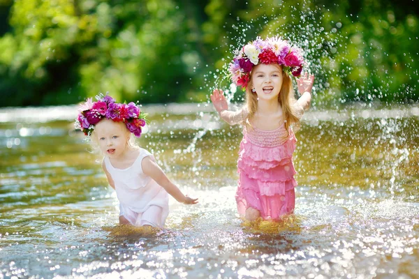 Sisters wearing wreaths