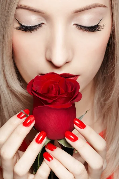 Blonde woman with rose