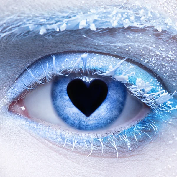 Frozen eye zone makeup and pupil in for of heart