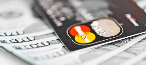 Mastercard Debit Card Over Dollar bills