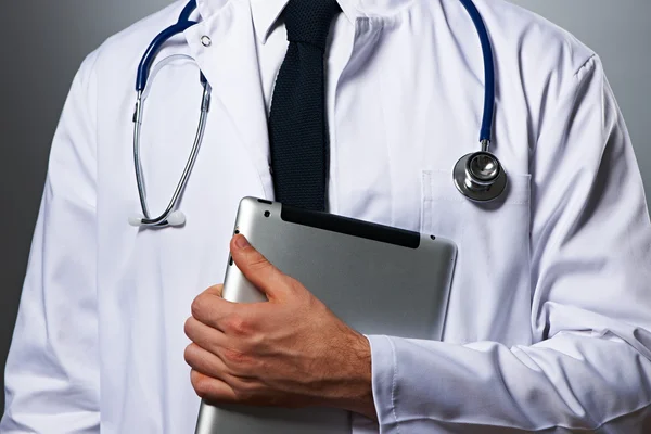 Medical doctor with tablet pc portrait