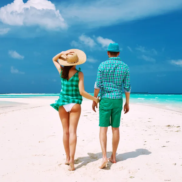 Couple in green on a beach at Maldives