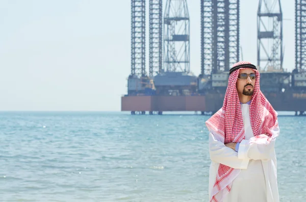 Arab on seaside in traditional clothing