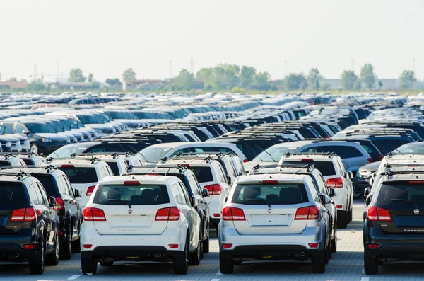 TUSCANY, ITALY - 27 June: New cars parked at distribution center