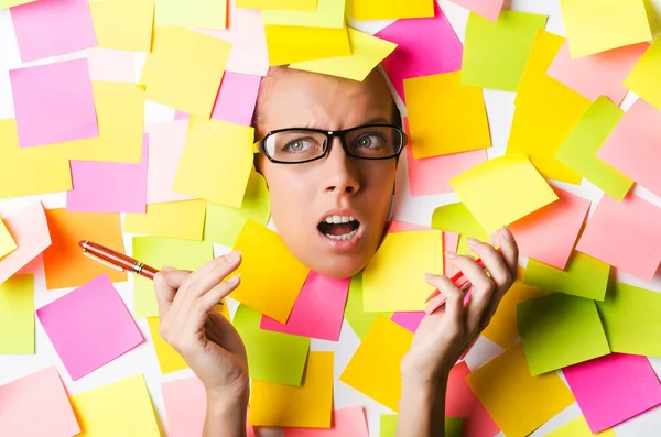 Businesswoman with lots of reminder notes — Stock Photo #24065351