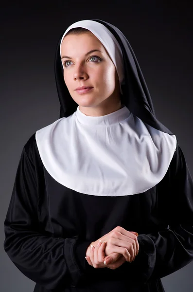 Young nun in religious concept — Stock Photo #24776205